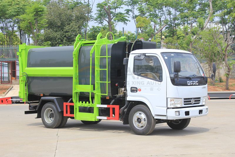 藍(lán)牌7.5方東風(fēng)多利卡壓縮式掛桶垃圾車